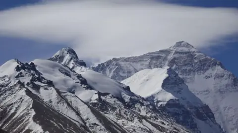 Blizzard Strikes Everest: Hikers Challenge Nature's Fury