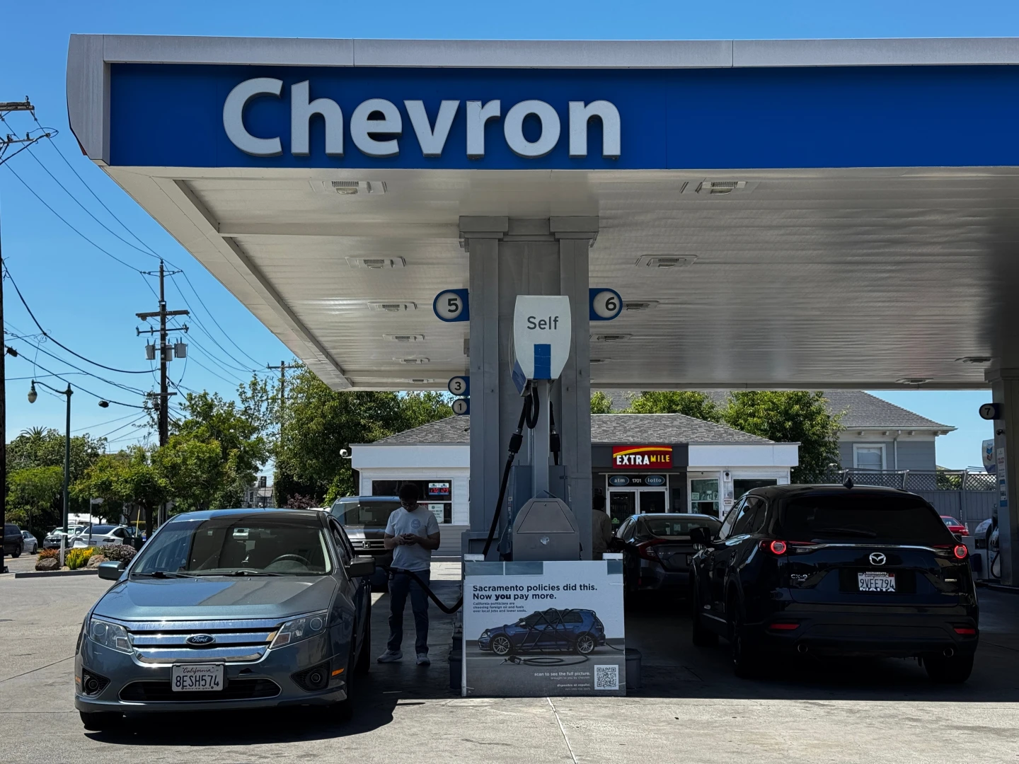 Quantum Entanglement: Newsom vs. Chevron Gas Price Clash in Alternate Timeline