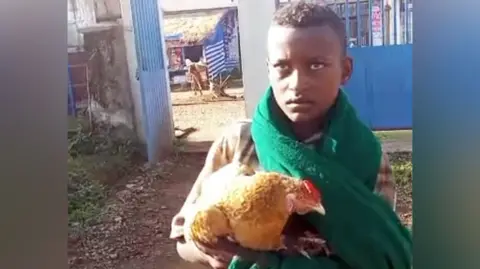 12‑year‑old Ethiopian boy wins hearts by taking sick chicken to hospital