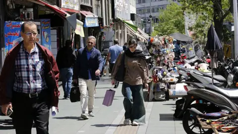 Tehran's Struggles: Battling Shortages Amid Tensions of War