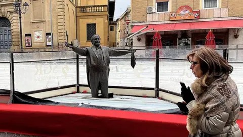 Controversial Pavarotti Statue Encased in Ice Rink Sparks Outrage in Italy