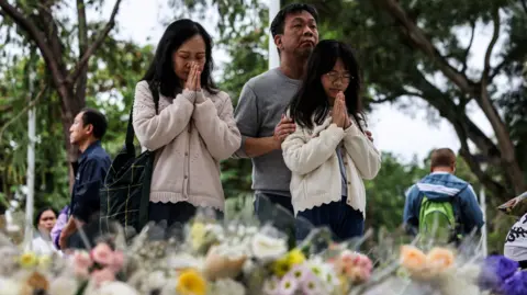 Tragedy Strikes: Hong Kong Fire Claims 146 Lives Amid Mourning